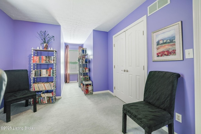 sitting room with carpet flooring