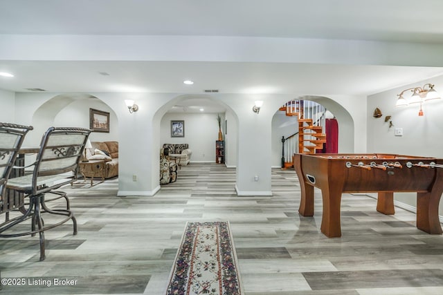 recreation room featuring light wood-type flooring