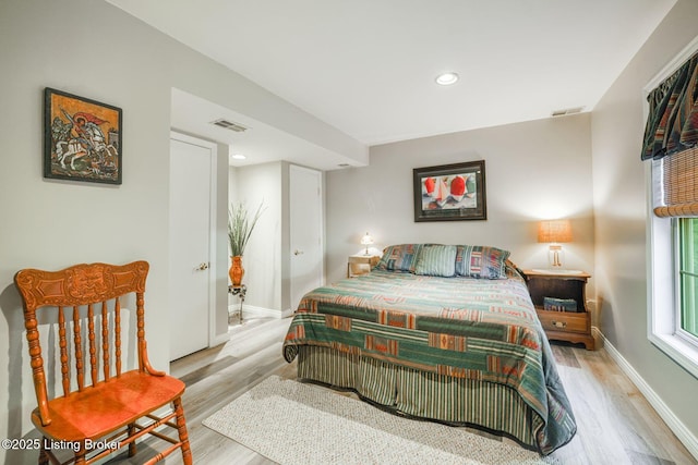 bedroom with light hardwood / wood-style floors