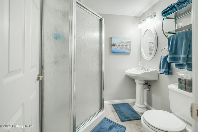 bathroom with toilet, an enclosed shower, and tile patterned flooring