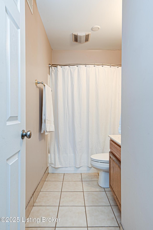 full bathroom with vanity, shower / bath combo, tile patterned floors, and toilet