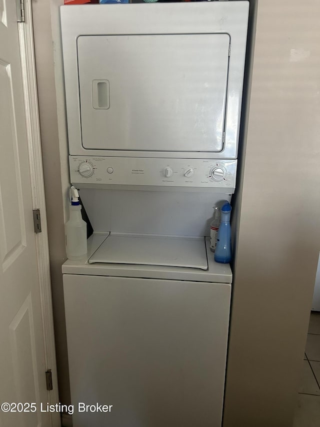 clothes washing area with stacked washer / drying machine