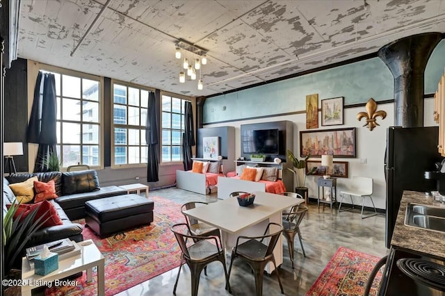 living room featuring an inviting chandelier