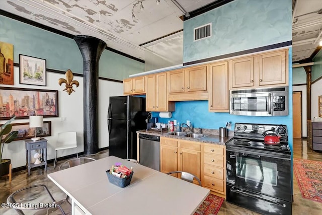 kitchen featuring sink, light brown cabinetry, and black appliances