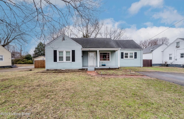 view of front of house featuring covered porch and a front yard