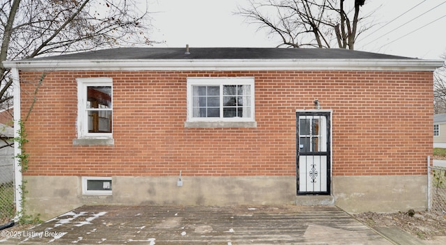 back of house featuring a wooden deck