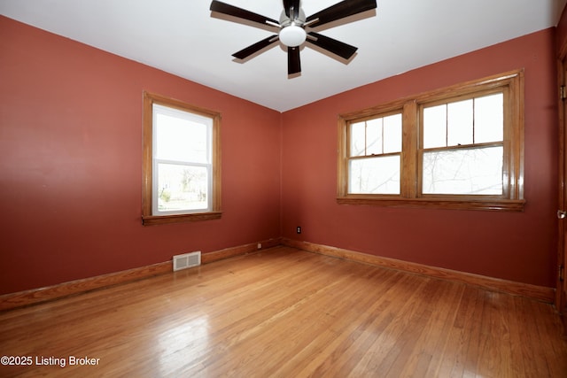 spare room with ceiling fan and light hardwood / wood-style floors