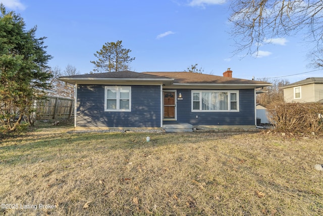 ranch-style house featuring a front lawn