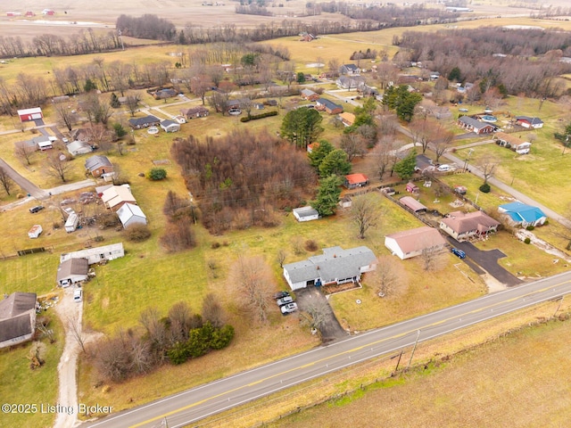 birds eye view of property featuring a rural view