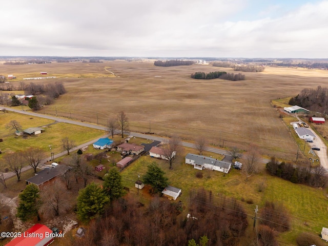 birds eye view of property with a rural view