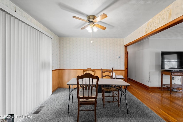 dining space featuring hardwood / wood-style floors and ceiling fan