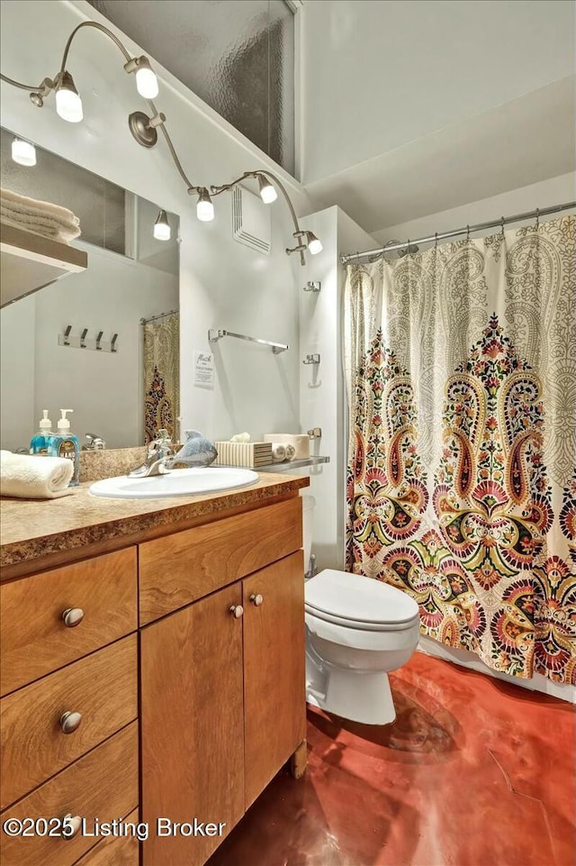 bathroom with vanity and toilet