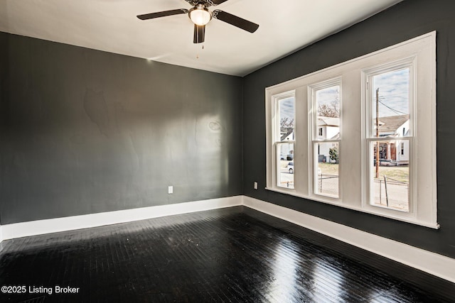 unfurnished room featuring hardwood / wood-style flooring, ceiling fan, and plenty of natural light