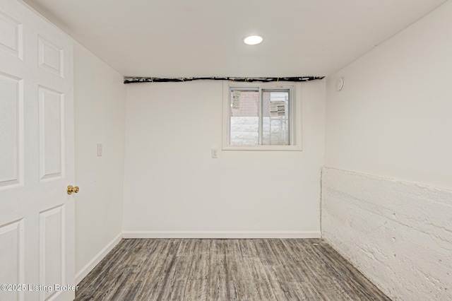 spare room with hardwood / wood-style floors