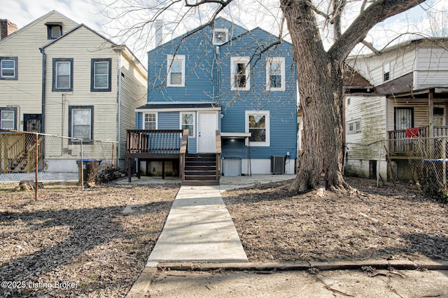 view of front of home featuring cooling unit and a deck