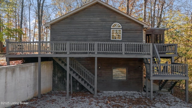 rear view of property featuring a deck