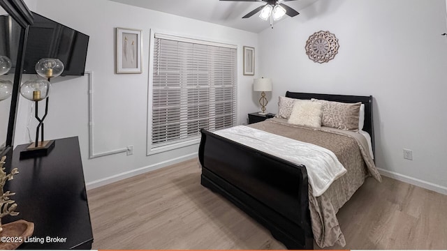 bedroom featuring ceiling fan and light hardwood / wood-style flooring