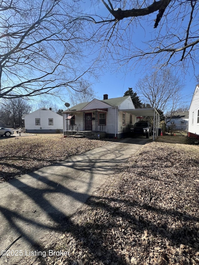 view of front of house with a carport and covered porch