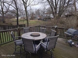 wooden deck with a grill