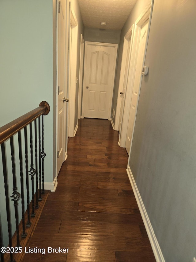 hallway featuring dark hardwood / wood-style floors