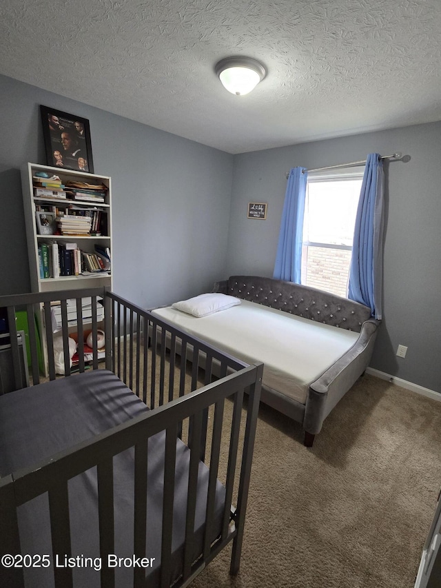 bedroom with carpet flooring and a textured ceiling