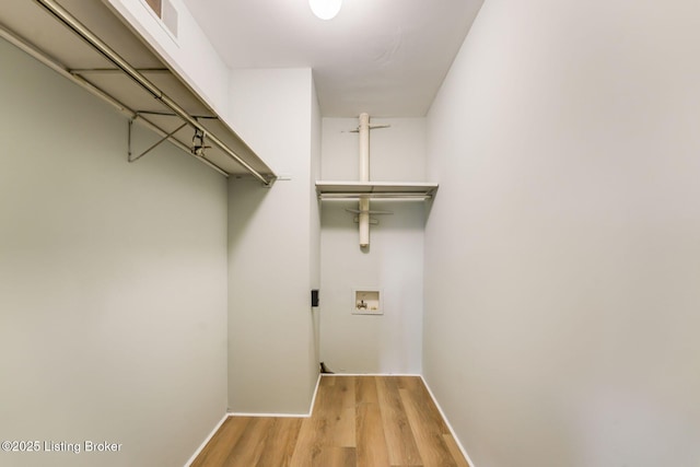 walk in closet featuring light wood-style floors and visible vents