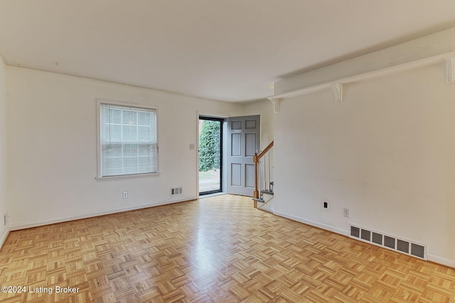 empty room featuring light parquet flooring