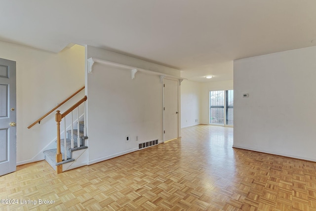 empty room with light parquet flooring