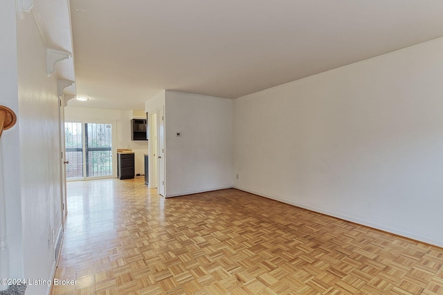 unfurnished room featuring light parquet floors