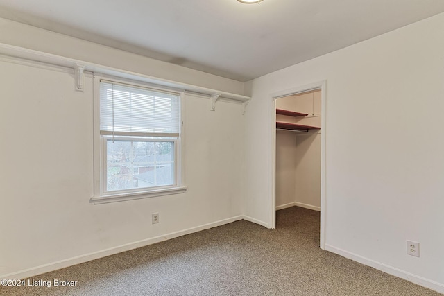 walk in closet with carpet flooring