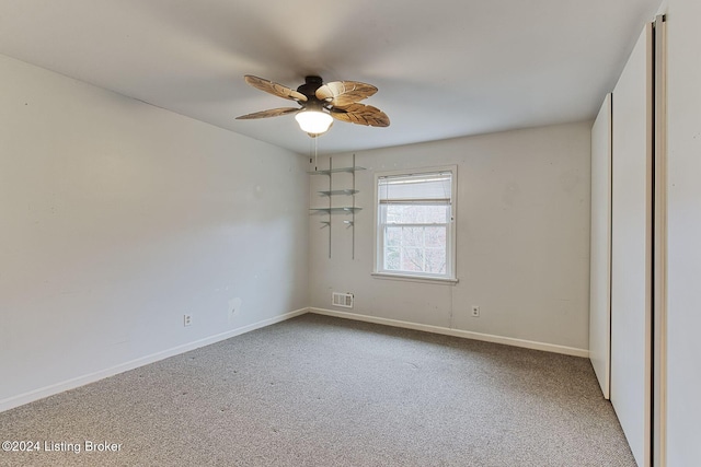 unfurnished bedroom featuring light carpet and ceiling fan