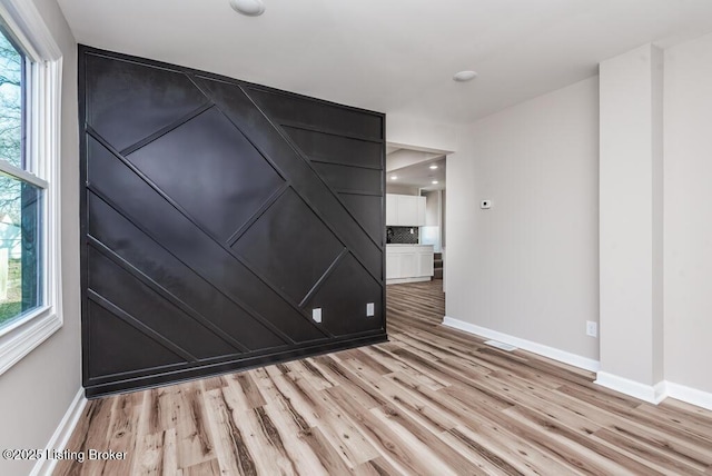 empty room featuring light hardwood / wood-style floors