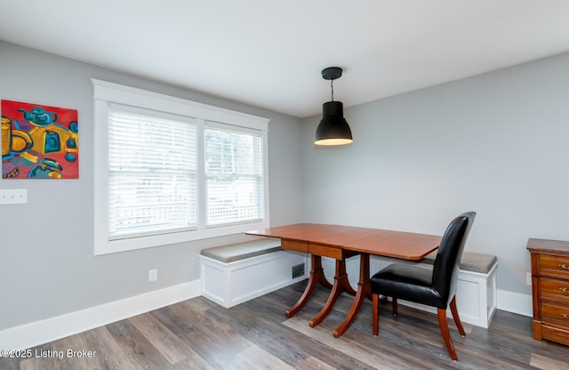 dining room featuring dark hardwood / wood-style floors and breakfast area