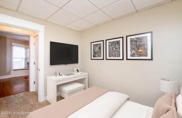 bedroom with a paneled ceiling