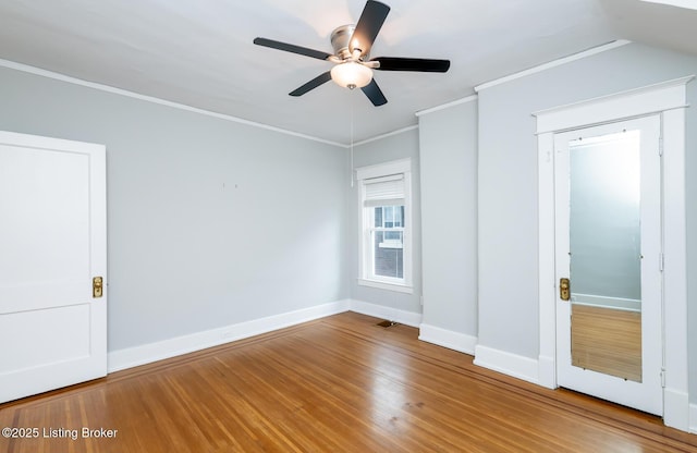 unfurnished bedroom featuring crown molding, ceiling fan, and hardwood / wood-style flooring