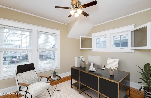 office area with crown molding, wood-type flooring, and ceiling fan