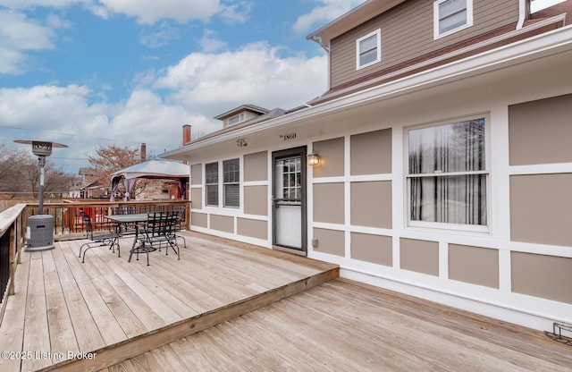 wooden terrace with a gazebo