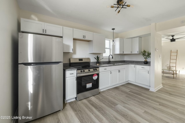 kitchen featuring white cabinetry, stainless steel appliances, and sink