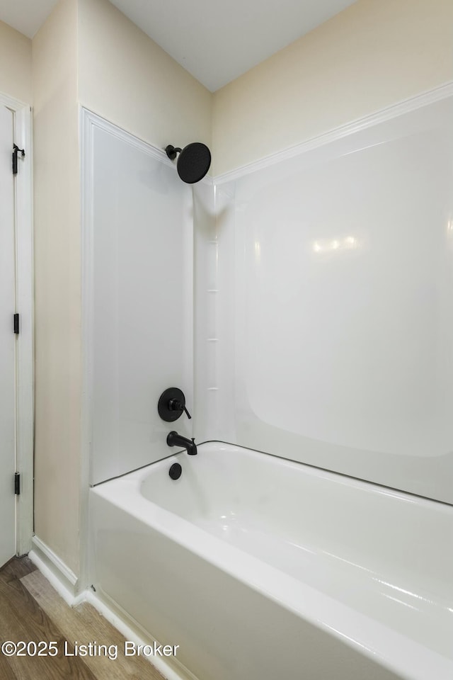 bathroom featuring shower / bath combination and wood-type flooring