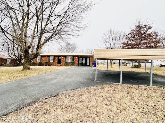 view of front of home featuring a carport