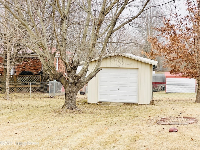 garage featuring a yard