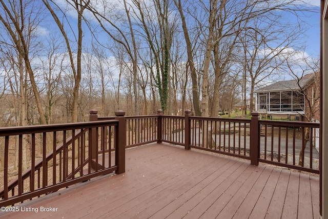 wooden terrace featuring a sunroom