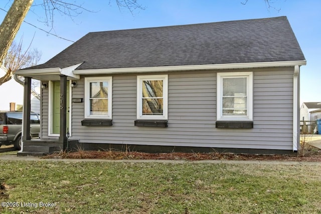 view of side of home featuring a lawn