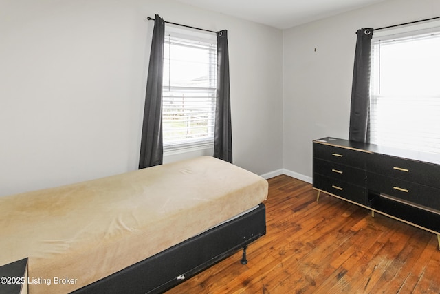 bedroom featuring dark hardwood / wood-style flooring