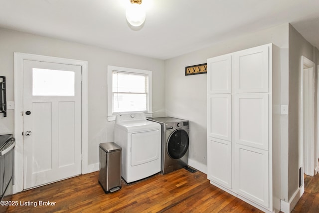 laundry room featuring separate washer and dryer and dark hardwood / wood-style floors