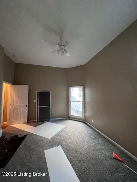 unfurnished room with carpet, baseboards, and ceiling fan