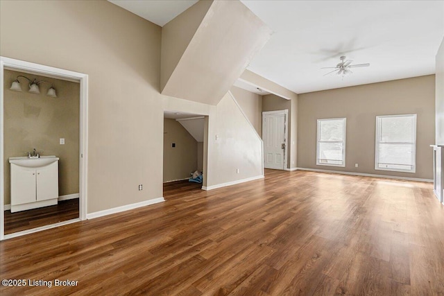 2715 W Market St, Louisville, KY 40212 - unfurnished living room featuring a ceiling fan and wood finished floors