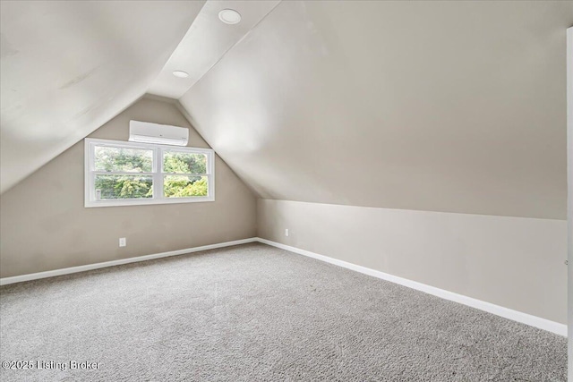 2715 W Market St, Louisville, KY 40212 - bonus room with a wall mounted air conditioner, vaulted ceiling, carpet flooring, and recessed lighting