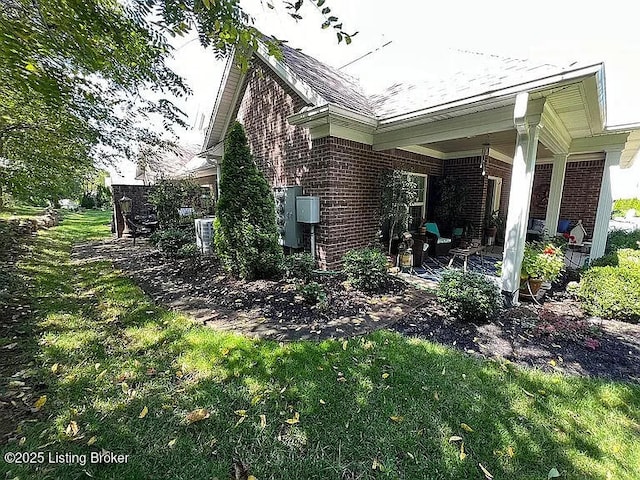 view of home's exterior with a yard