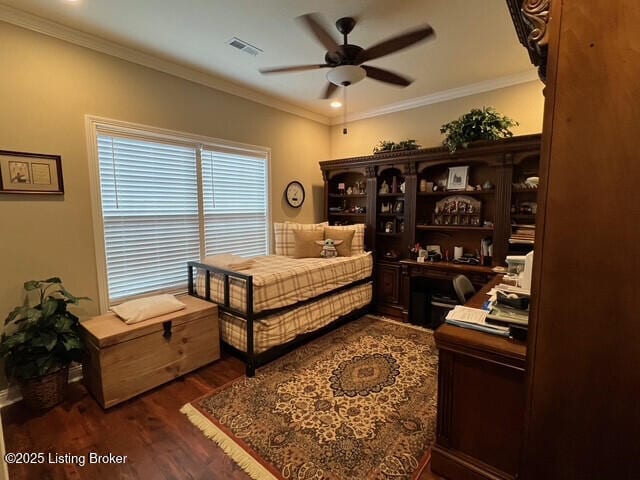 bedroom with ornamental molding, dark hardwood / wood-style floors, and ceiling fan